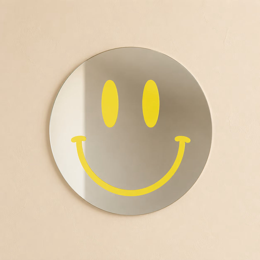 Yellow Smiling Reflections acrylic mirror on a neutral wall