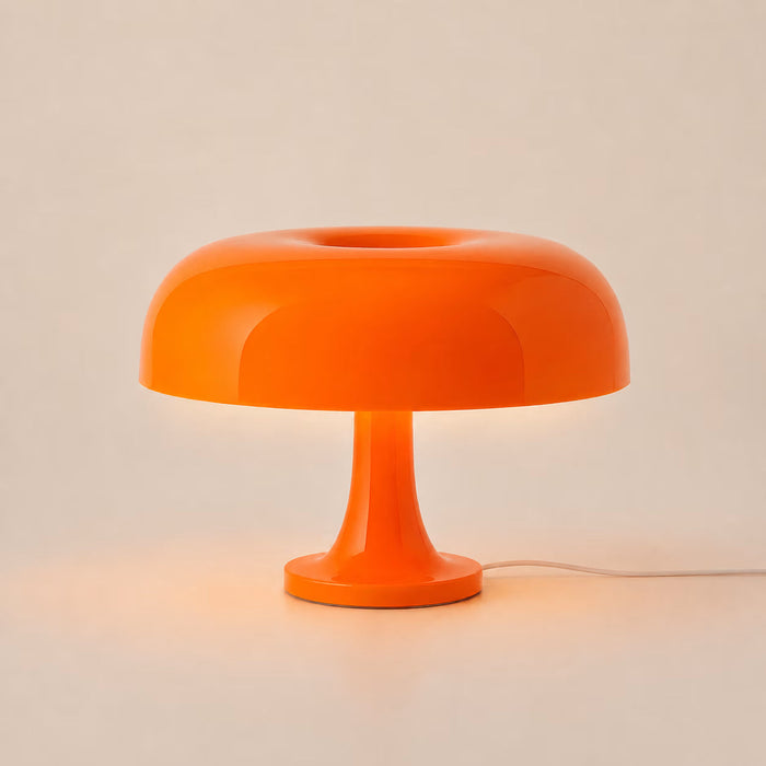 Orange 1970s-style mushroom table lamp with a domed shade