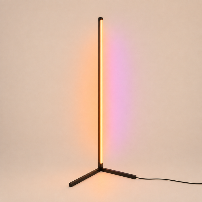 Ambient RGB corner floor lamp casting warm orange and pink light onto a wall