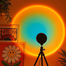 Sunset projection lamp casting coloured light across a wall
