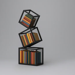 Rotating Cube Bookshelf styled with books and decorative objects