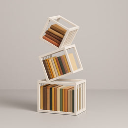 White geometric bookshelf styled with books and objects