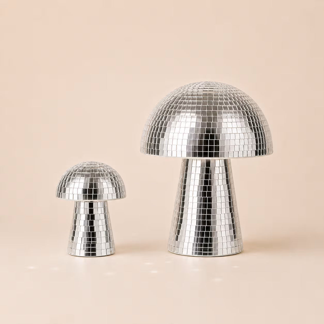 Three silver Disco Mushrooms covered in reflective mirrored sequins