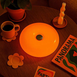 Wall-mountable Donut lamp with warm ambient light