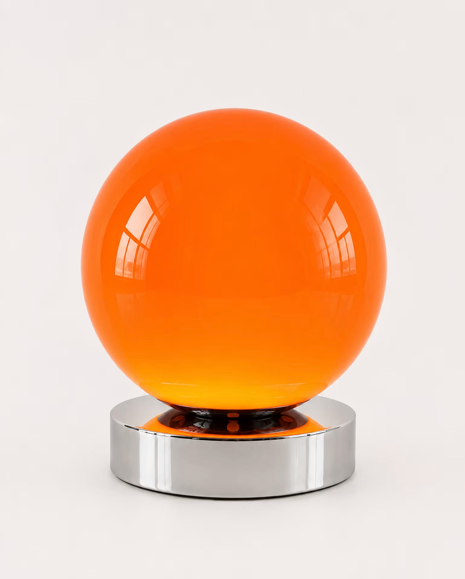 Low-profile orange globe bedside lamp with nine brightness levels