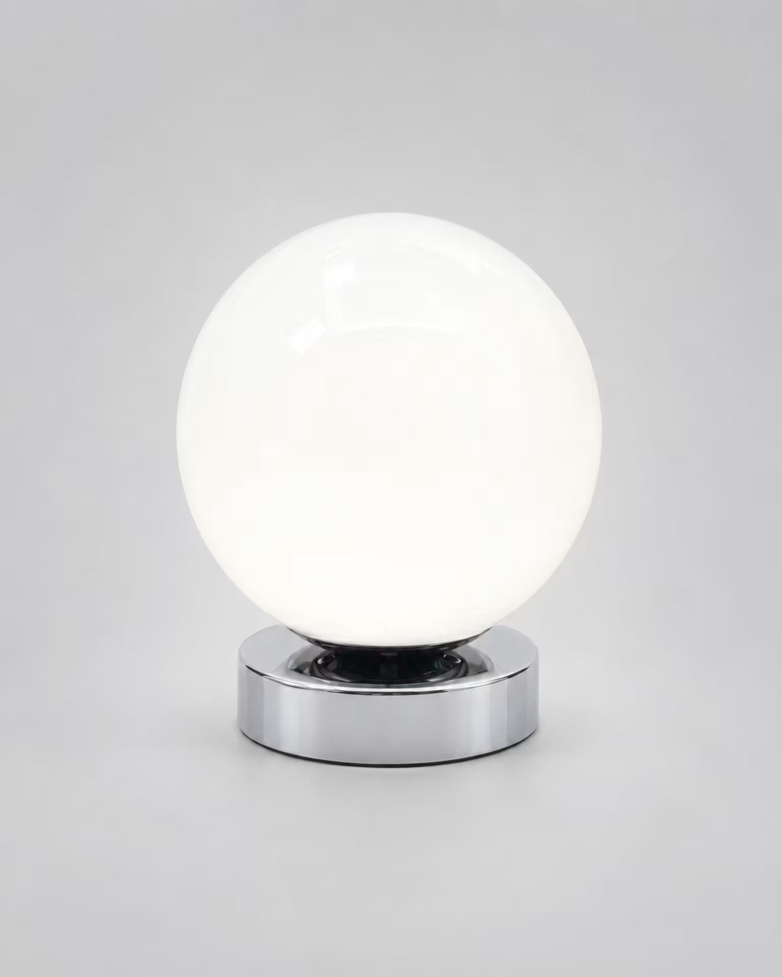 Low-profile white globe bedside lamp with nine brightness levels