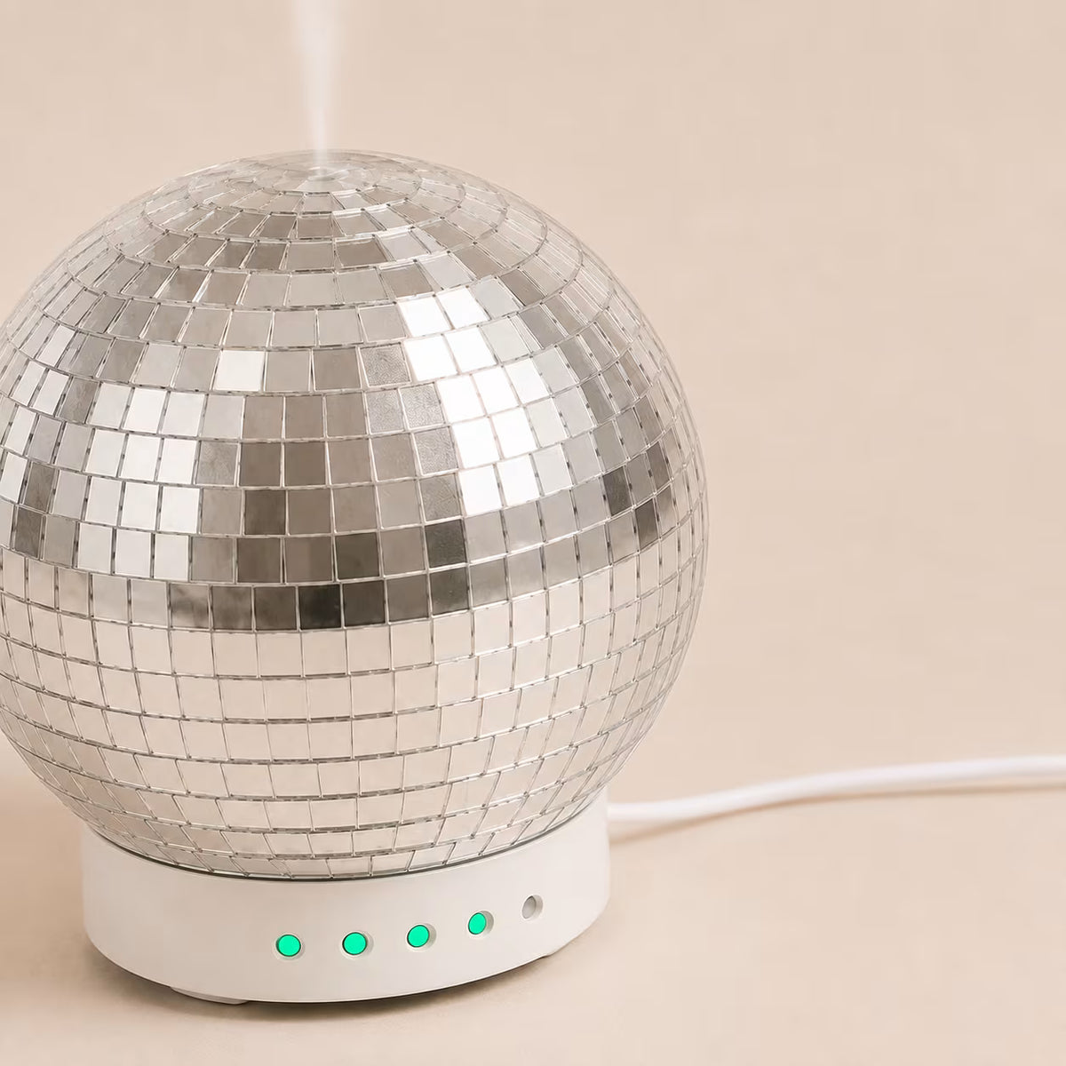 Mirrored Disco Ball Aroma Diffuser on its rotating white base