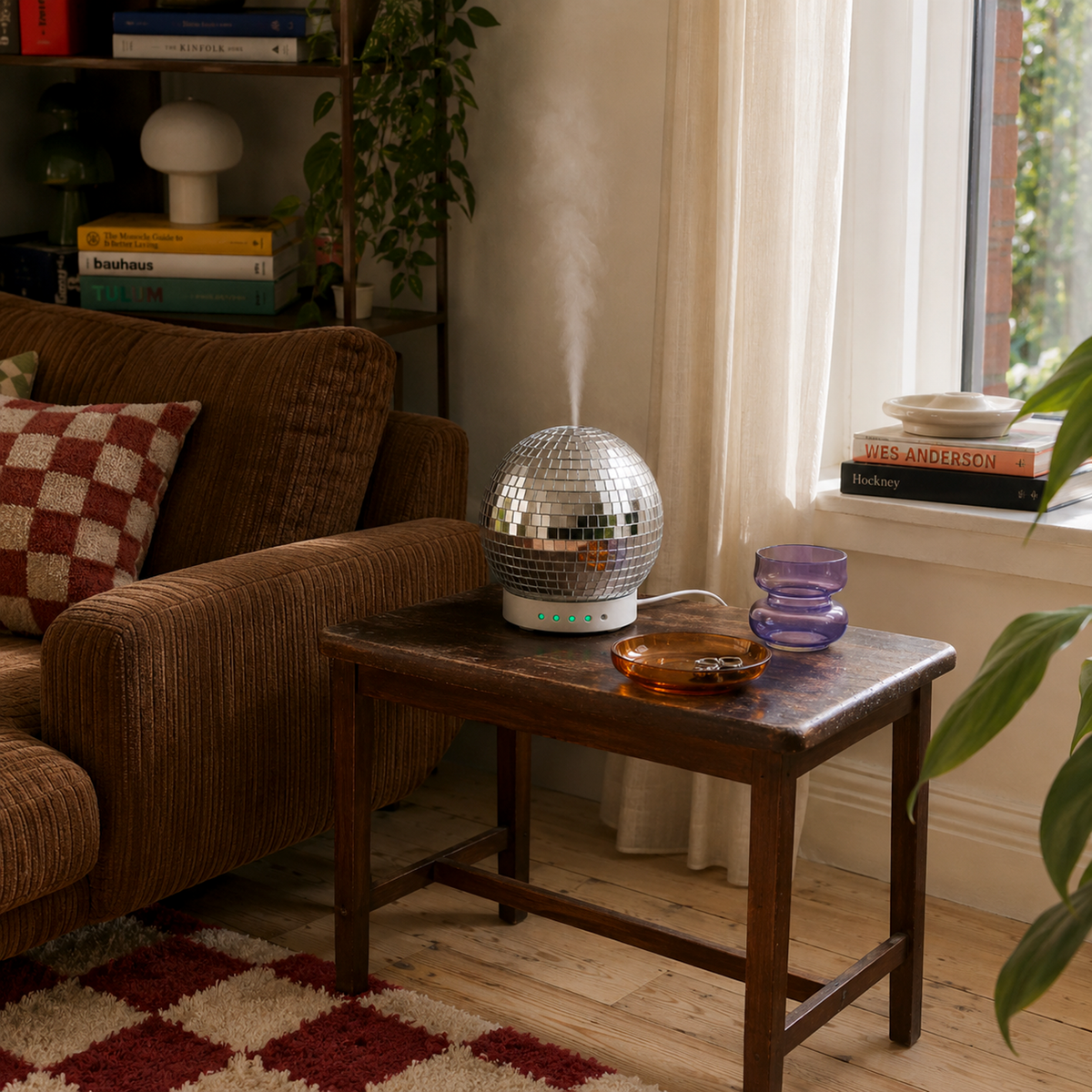 Disco Ball Diffuser casting reflective light in a styled living room