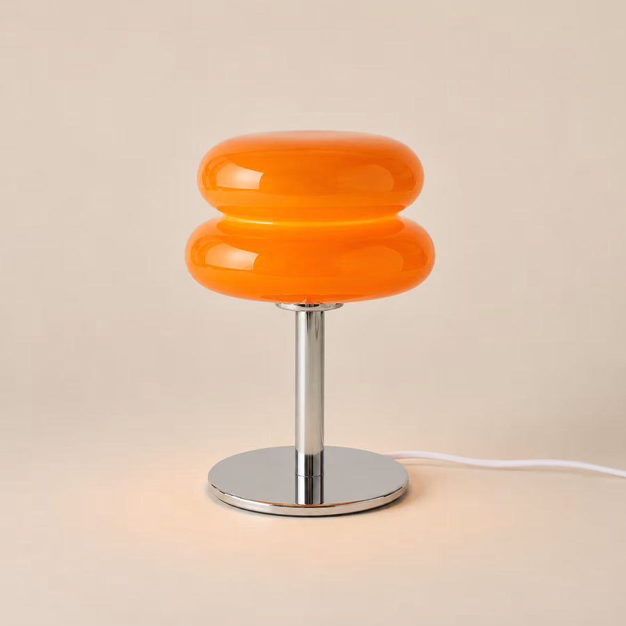 Orange Macaron glass table lamp with a low domed shade and plated-iron base