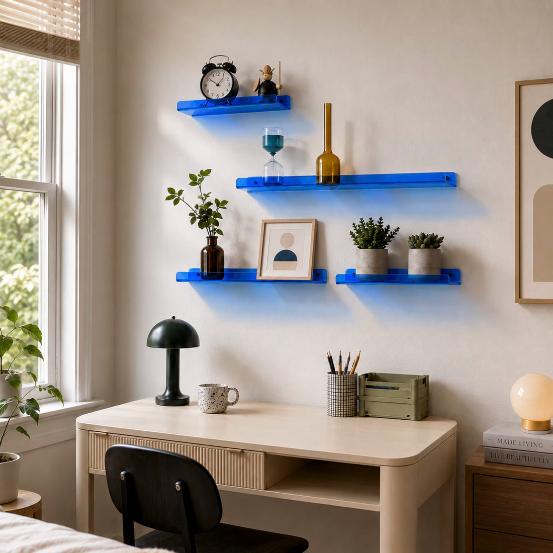 Blue acrylic shelves arranged in different sizes above a home desk