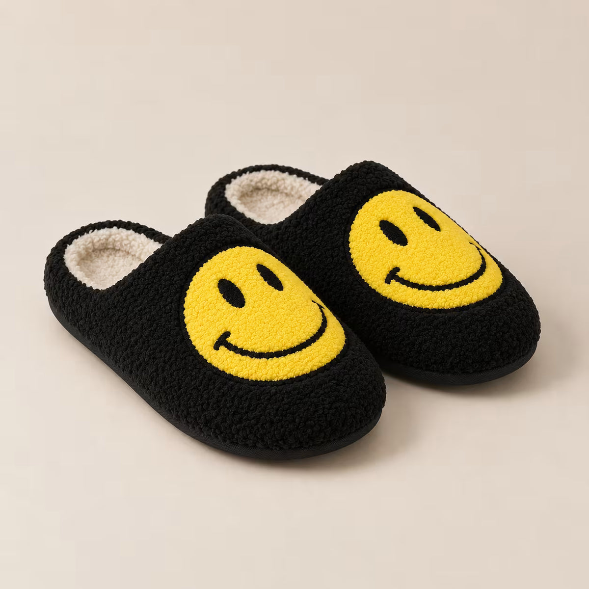 Black smiley face plush slippers