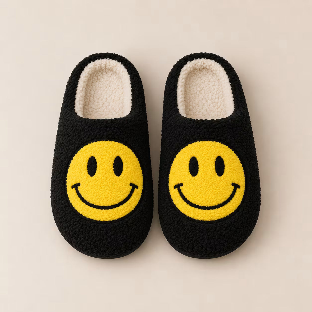Black smiley face plush slippers, alternate view