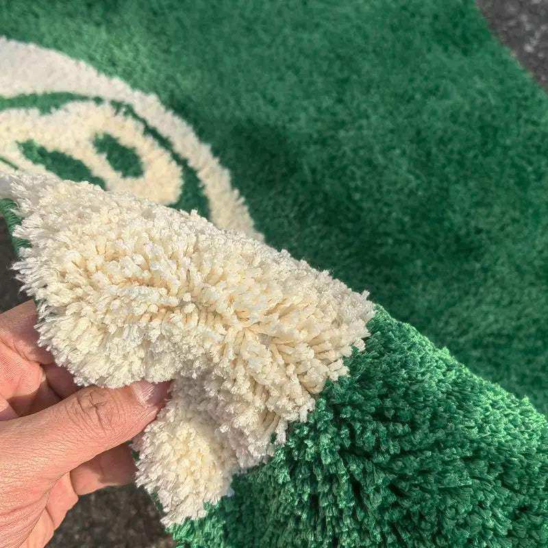 Close view of the tufted green 8 ball mat