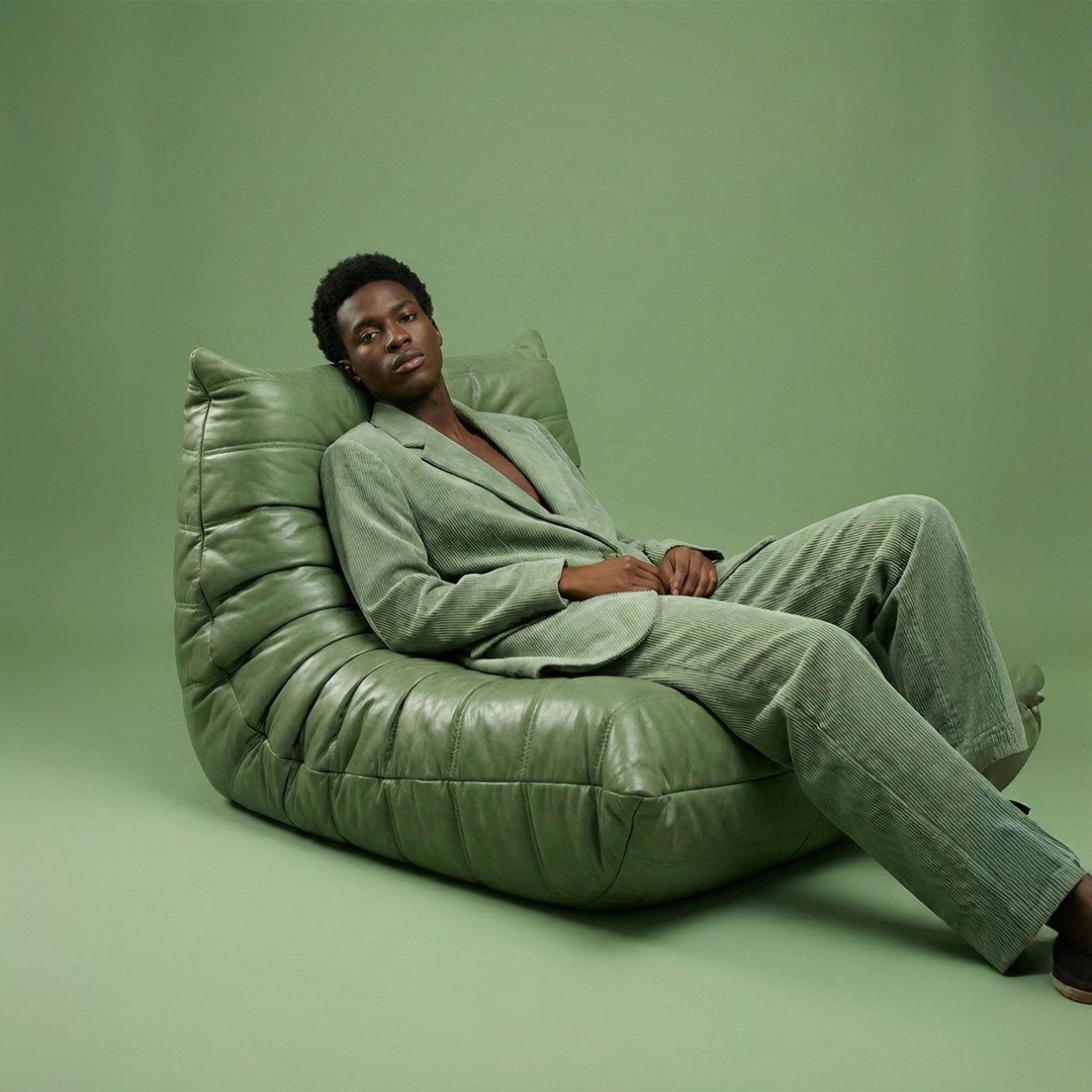 Green Caterpillar Lounger Chair anchoring a styled living-room corner