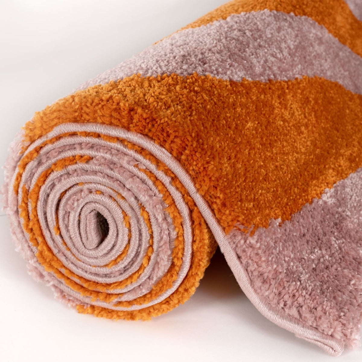 Sorbet Stripe Rug — rolled side view