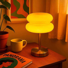Retro orange glass bedside lamp with compact round shade