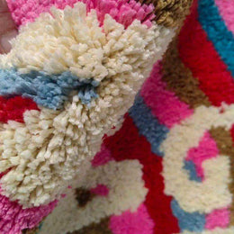 Plush Rainbow Get Naked bath mat surface