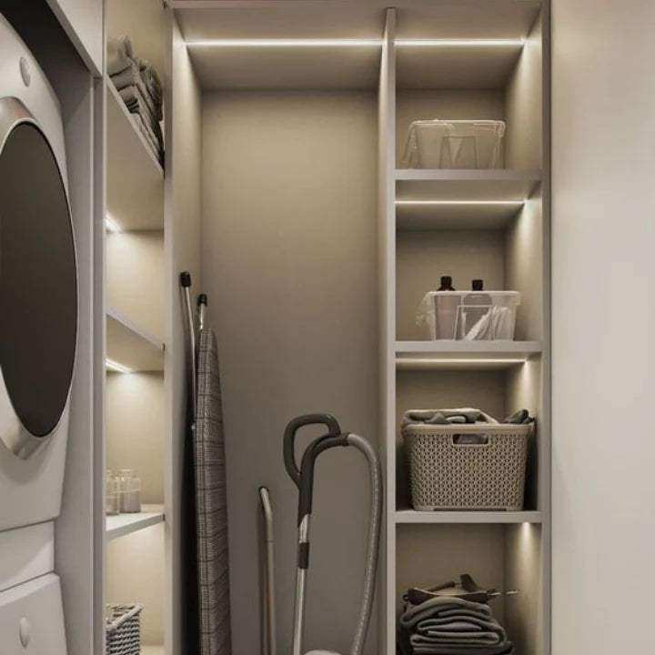 Magnetic under-cabinet light with self-adhesive mounting strip