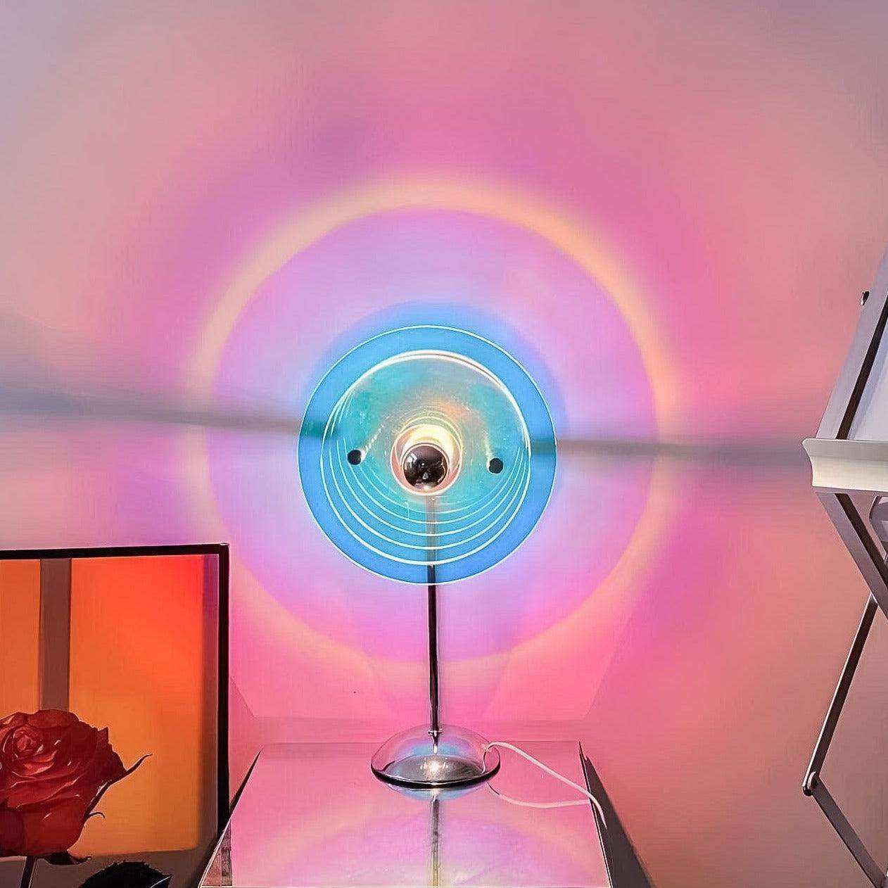 Sunset projection lamp casting circular colour on a wall
