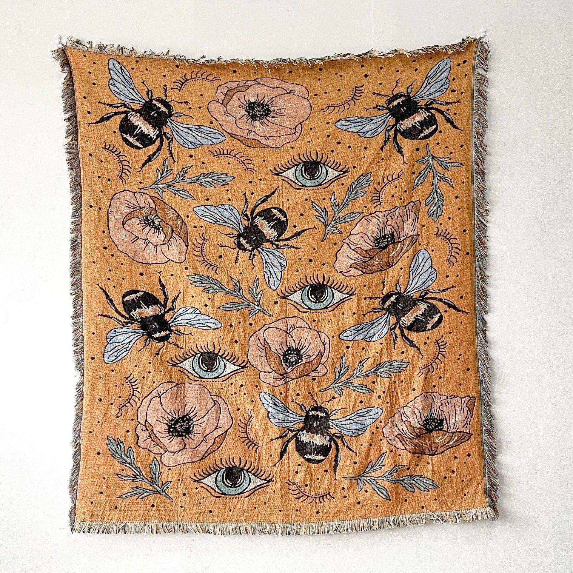 Cotton Bumble Bee throw featuring bees, eye motifs and florals