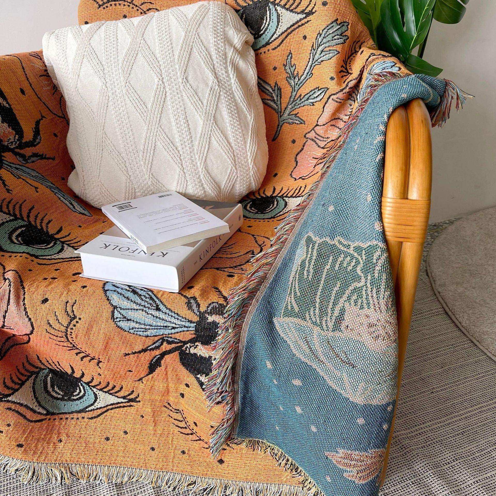 Orange woven throw styled across interior furniture