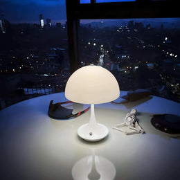 White Luna mushroom lamp on a bedside table