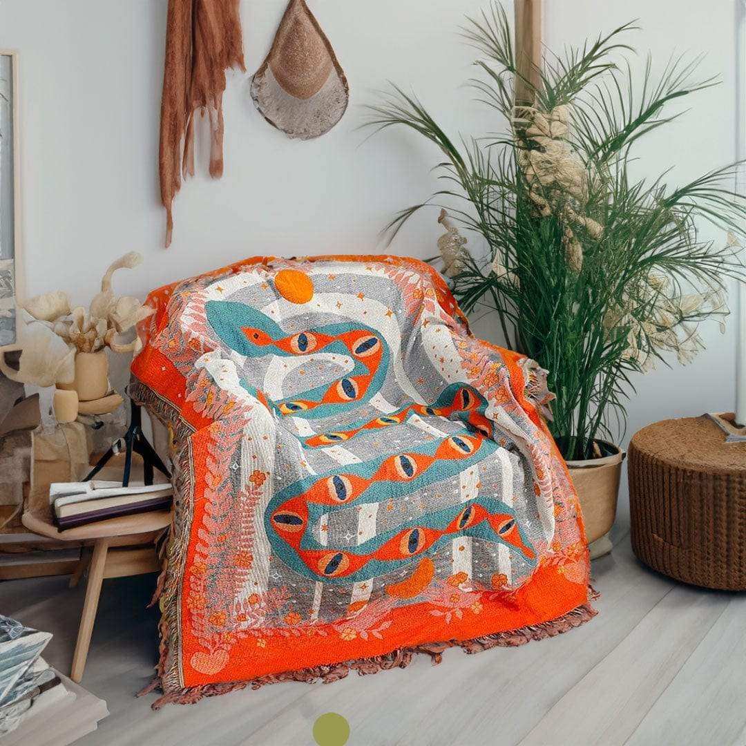 Serpent woven throw styled as graphic indoor wall decor