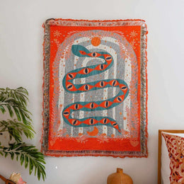 Serpent woven tapestry throw with bold snake artwork and tasselled edge