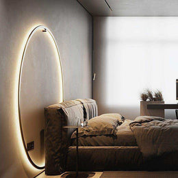 Minimalist LED ring wall light displayed in a modern interior