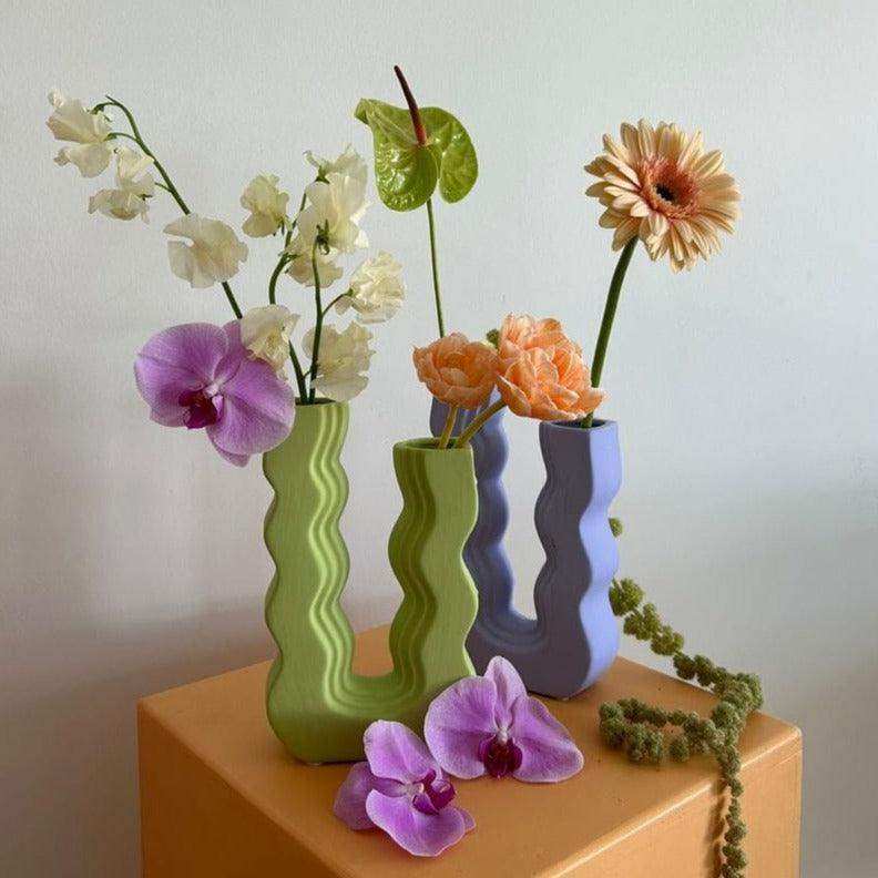 Wavy Wonder ceramic vase in its sculptural U-shaped form