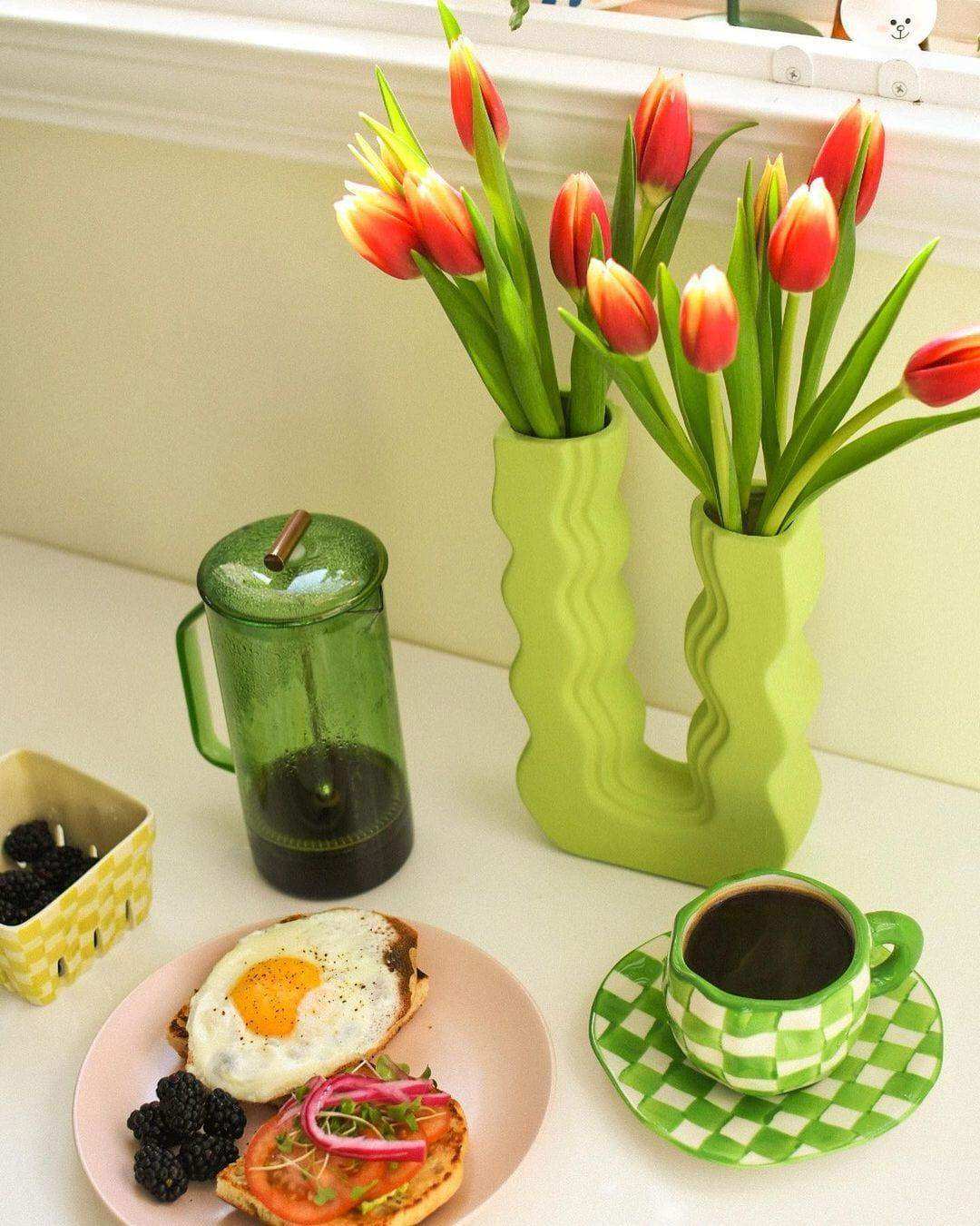 Small and large Wavy Wonder Vases styled together